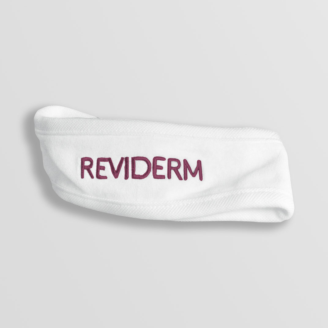 Stirnband weiß mit berry Logo